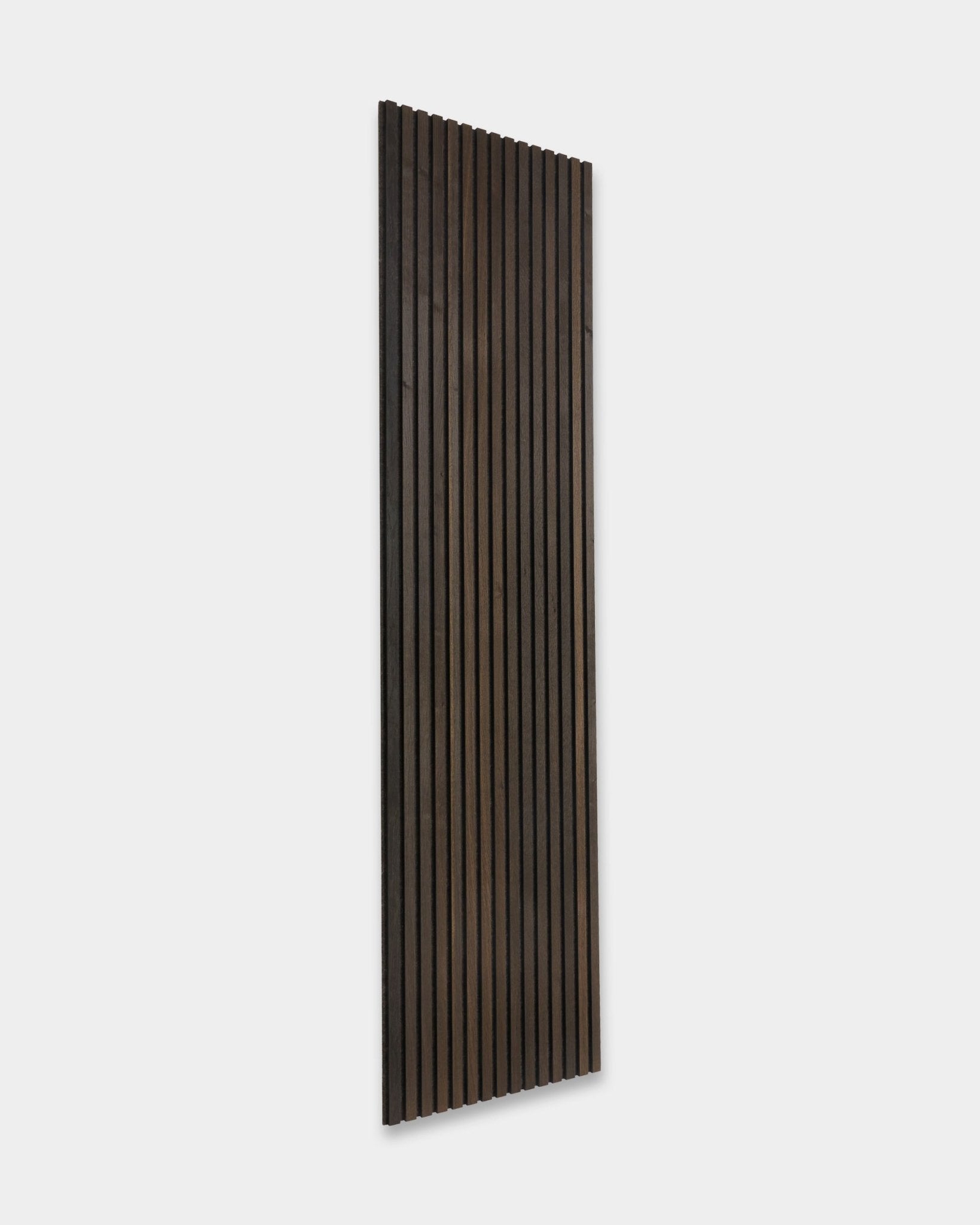 Tonal Akupanel acoustic panel by WoodUpp with vertical smoked oak slats in Nordic design, 240 x 60 cm, set against a light gray background.